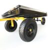 Black steel garden wagon in tipped position